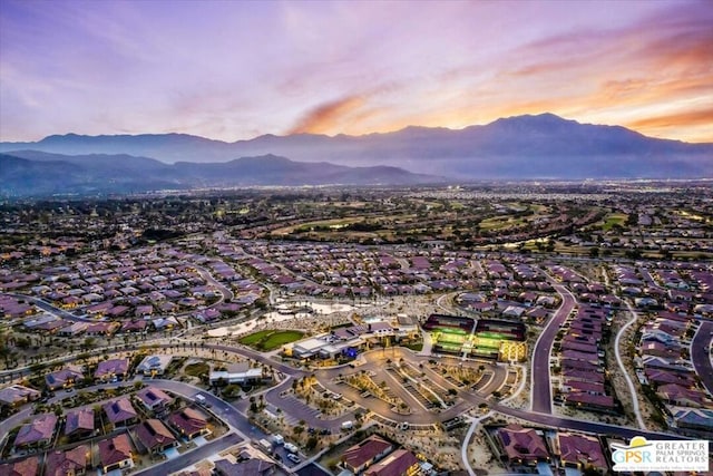 aerial view at dusk with a mountain view