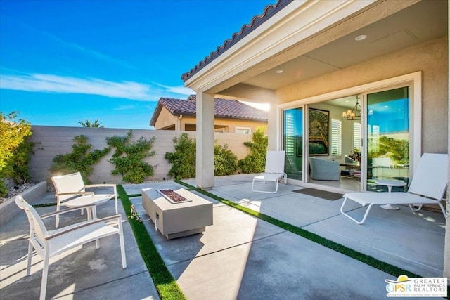 view of patio / terrace with a fire pit