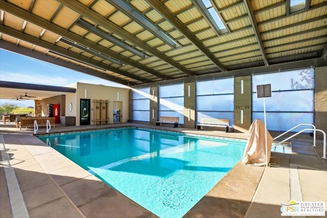 view of pool with ceiling fan and a patio