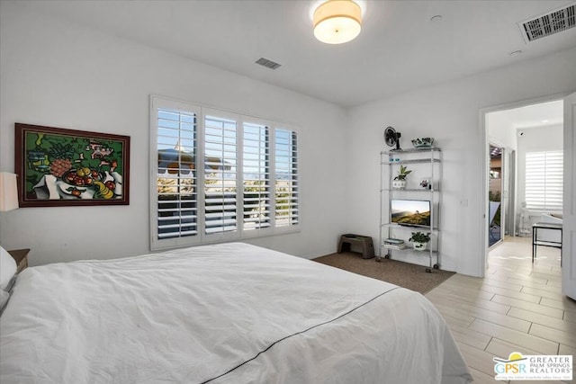 bedroom with light wood-type flooring