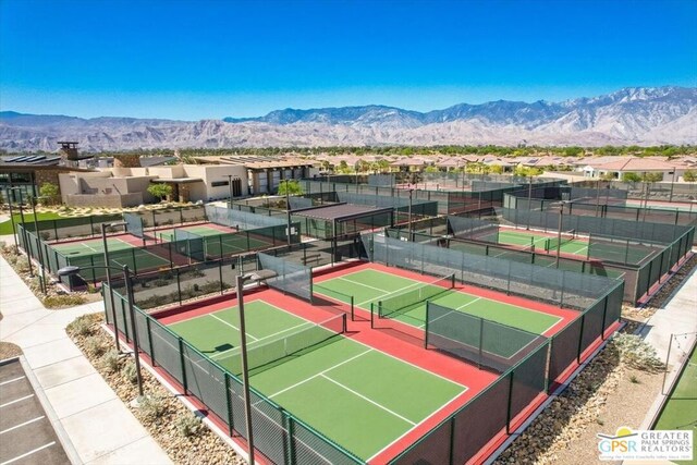 view of tennis court with a mountain view