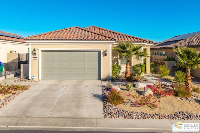 mediterranean / spanish-style home featuring a garage