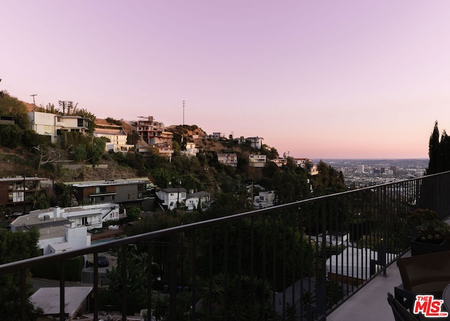 view of balcony at dusk