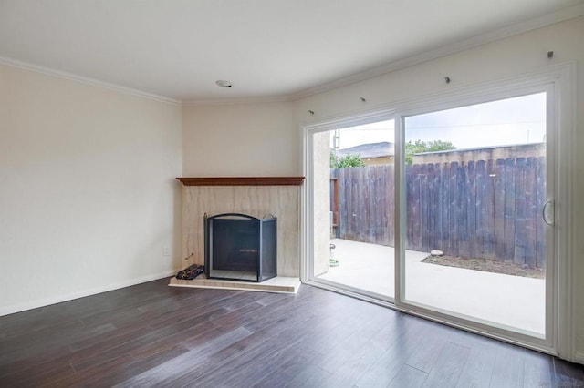 unfurnished living room with ornamental molding and hardwood / wood-style flooring