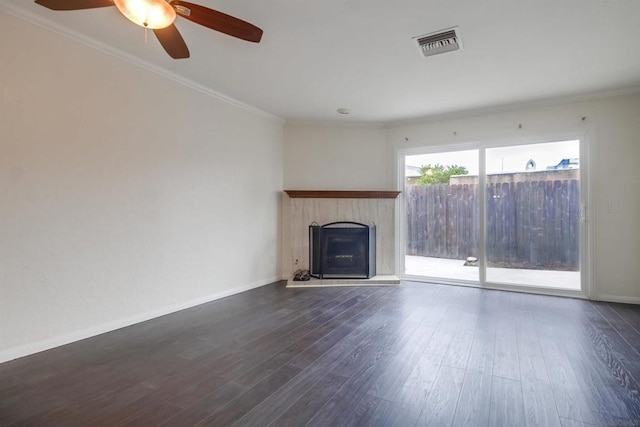 unfurnished living room with ceiling fan, dark hardwood / wood-style floors, and crown molding