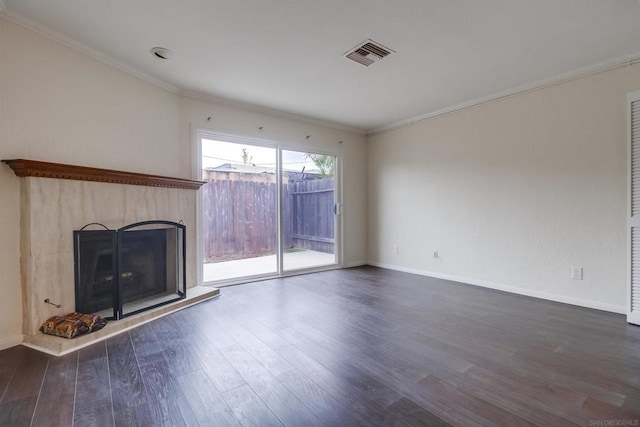 unfurnished living room with dark hardwood / wood-style floors and crown molding