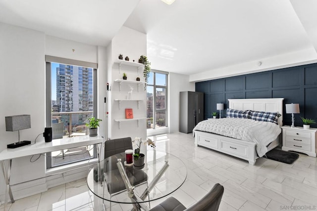 bedroom with floor to ceiling windows