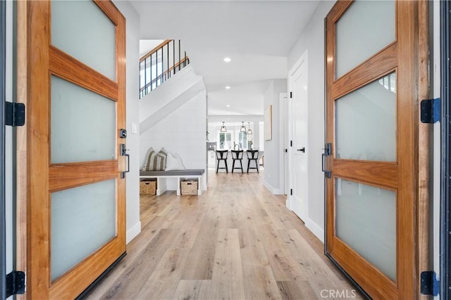 entrance foyer featuring light hardwood / wood-style floors