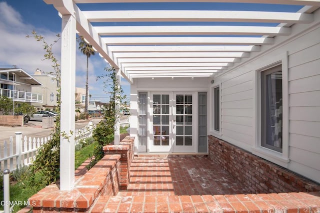 view of patio / terrace with french doors and a pergola