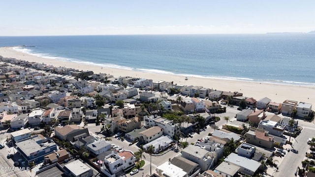 birds eye view of property featuring a view of the beach and a water view