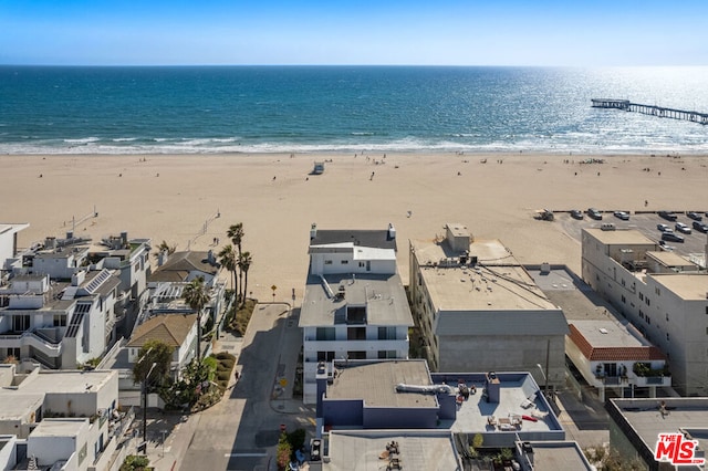 aerial view with a water view and a view of the beach