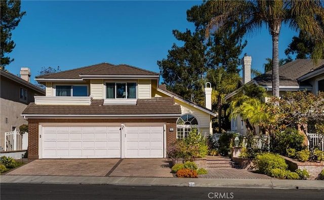 view of front of property with a garage