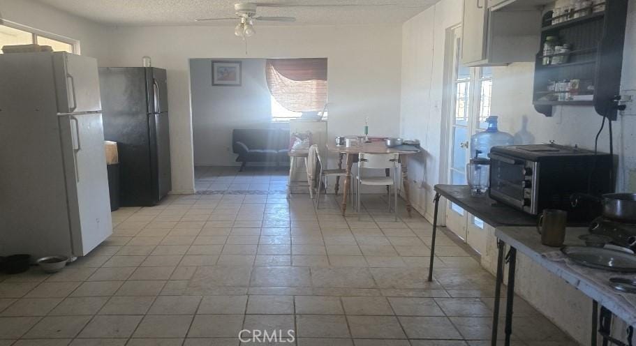 351 Neimeyer Pl, Yucca Valley, CA 92284 - kitchen featuring freestanding refrigerator, a textured ceiling, a toaster, and ceiling fan
