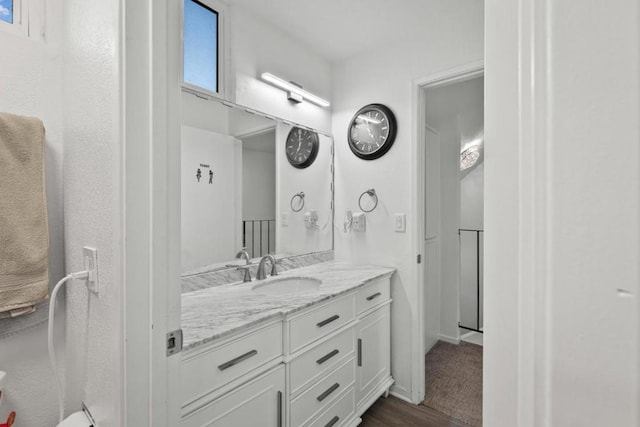 bathroom featuring vanity and hardwood / wood-style flooring