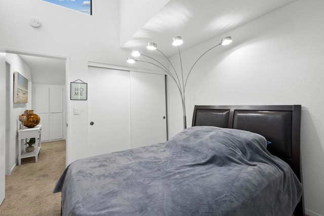 carpeted bedroom with a closet