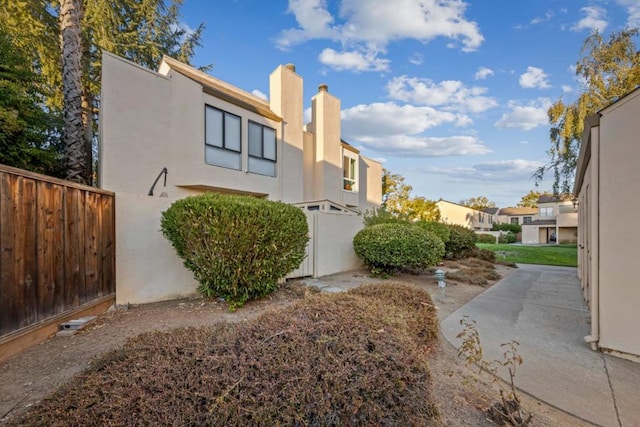 view of side of home featuring a patio