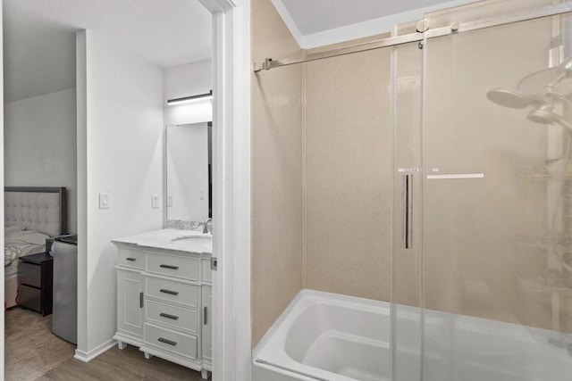 bathroom featuring shower with separate bathtub, wood-type flooring, and vanity