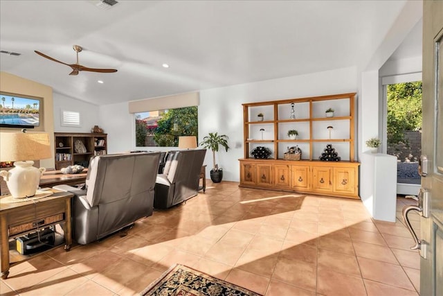 tiled living room featuring vaulted ceiling and ceiling fan