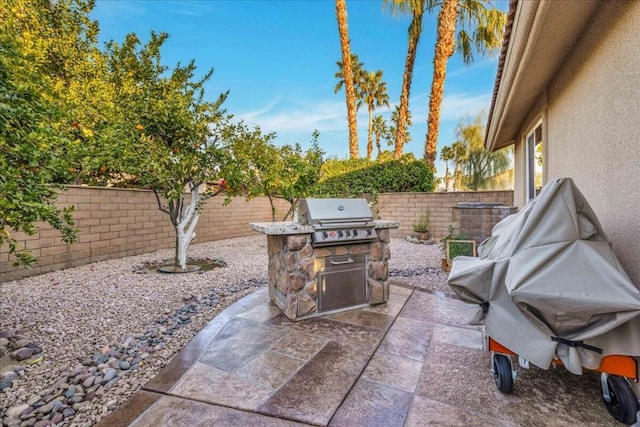 view of patio featuring a grill