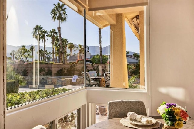 sunroom / solarium featuring a mountain view