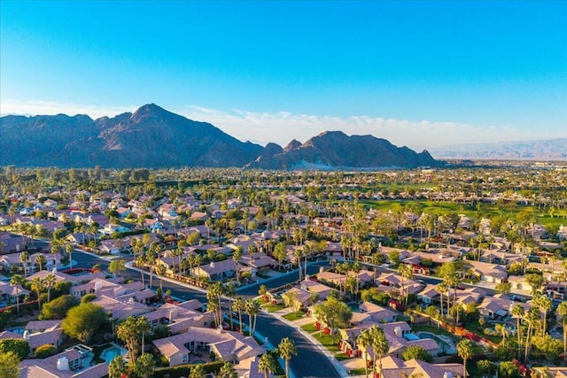 birds eye view of property featuring a mountain view