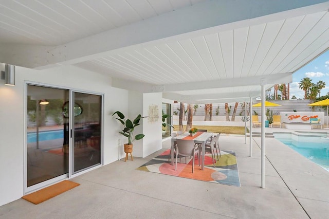 view of patio / terrace with a fenced in pool