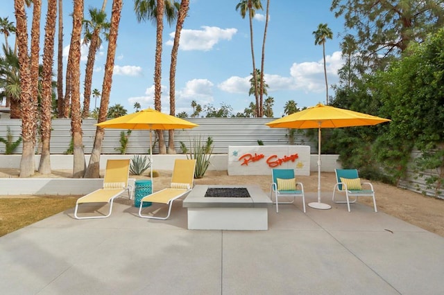 view of patio / terrace featuring an outdoor fire pit