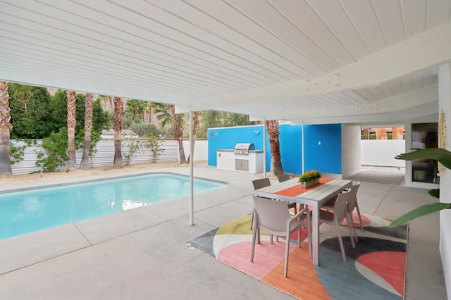 view of swimming pool with a patio and area for grilling