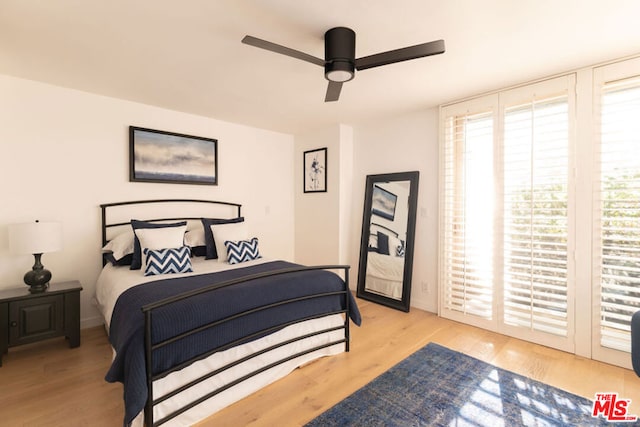 bedroom featuring ceiling fan and light hardwood / wood-style floors