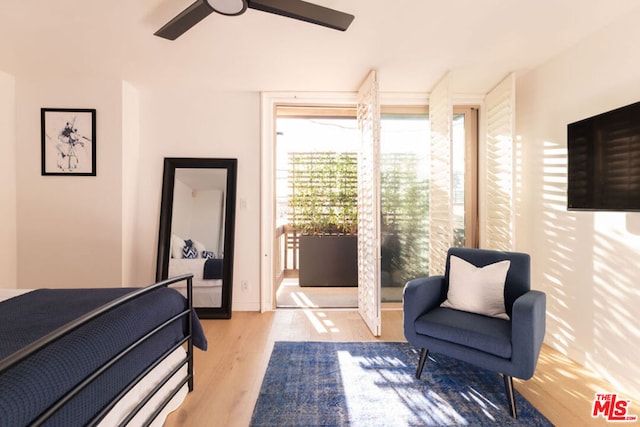 bedroom featuring ceiling fan and light wood-type flooring