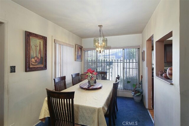 dining area featuring a chandelier