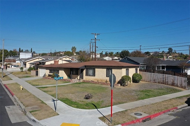 view of front facade featuring a front lawn and a garage