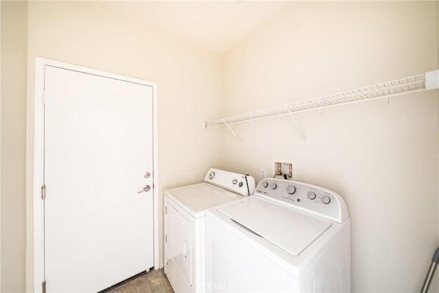 laundry area with washing machine and clothes dryer