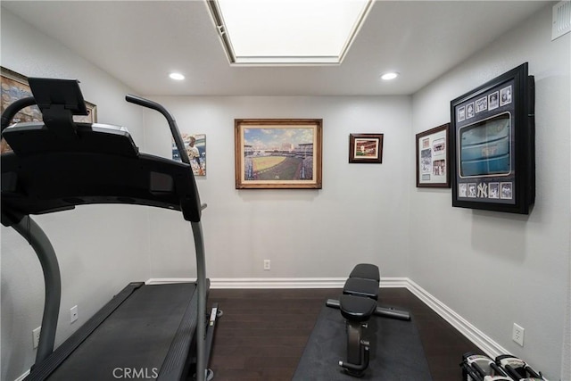 workout area featuring dark hardwood / wood-style floors