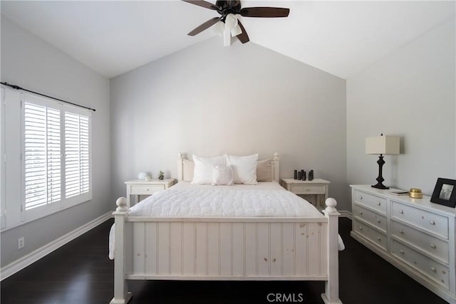 bedroom featuring ceiling fan, dark hardwood / wood-style flooring, and lofted ceiling