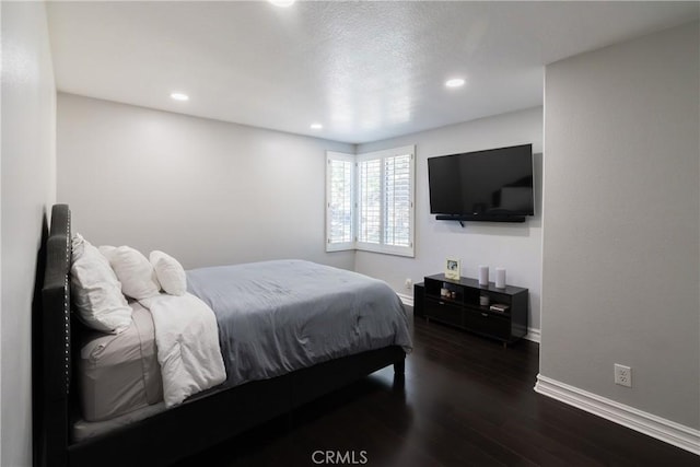 bedroom featuring dark hardwood / wood-style floors