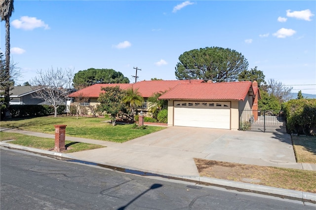 ranch-style house with a garage and a front yard