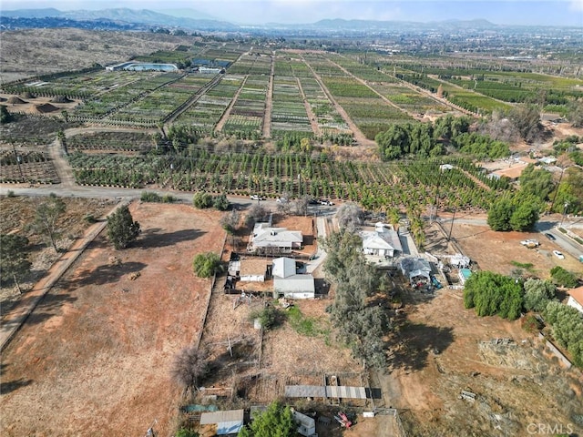 birds eye view of property featuring a mountain view and a rural view