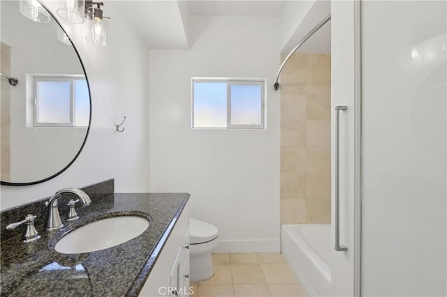 full bathroom featuring toilet, a wealth of natural light, vanity, and tile patterned floors