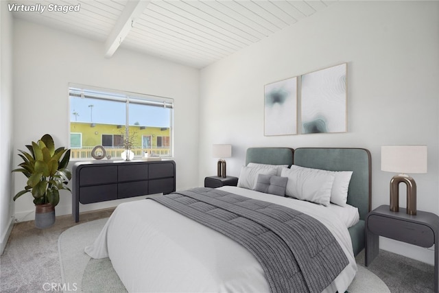 carpeted bedroom featuring beam ceiling and wooden ceiling