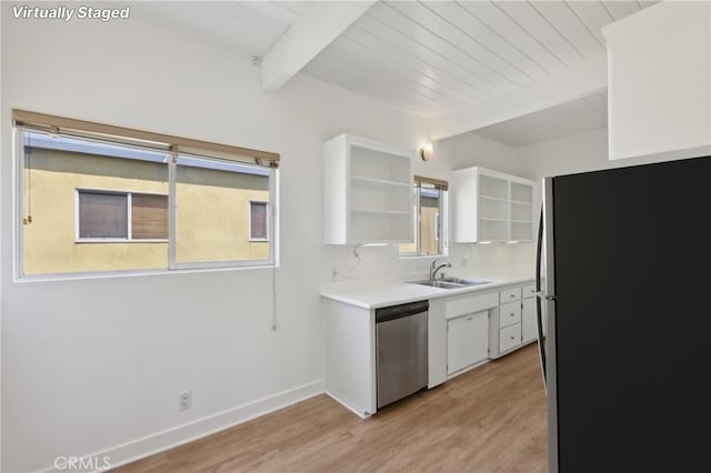 kitchen featuring beamed ceiling, light wood-type flooring, stainless steel appliances, white cabinets, and wooden ceiling