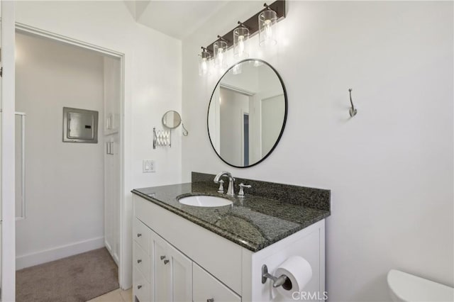 bathroom featuring toilet and vanity