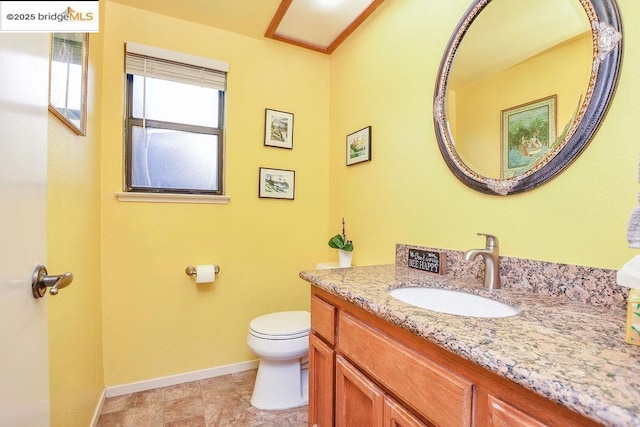 bathroom featuring toilet and vanity