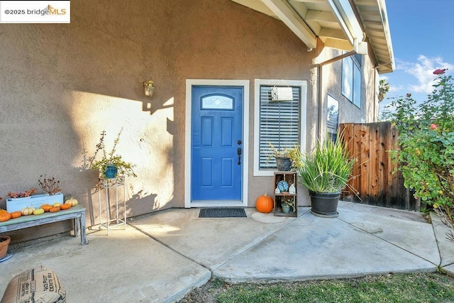 doorway to property featuring a patio area