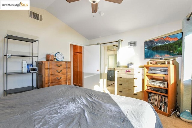 carpeted bedroom featuring ceiling fan and lofted ceiling