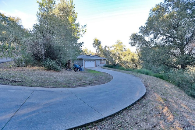 view of yard featuring a garage