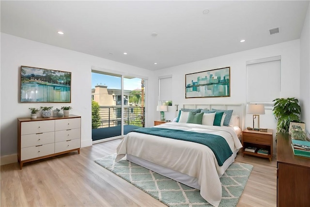 bedroom featuring access to exterior and light hardwood / wood-style floors