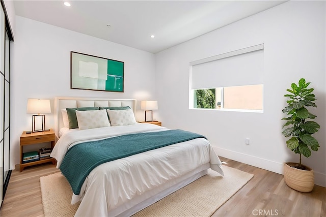 bedroom with light wood-type flooring