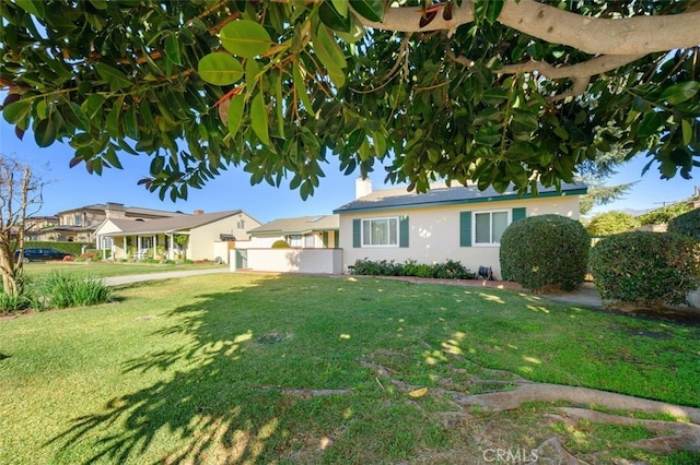 ranch-style house with a front yard