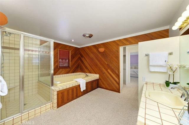 bathroom with vanity, wooden walls, ornamental molding, and plus walk in shower